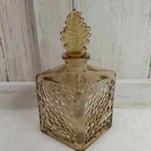 Elegant Brown Textured Glass Bottle with Leaf Stopper